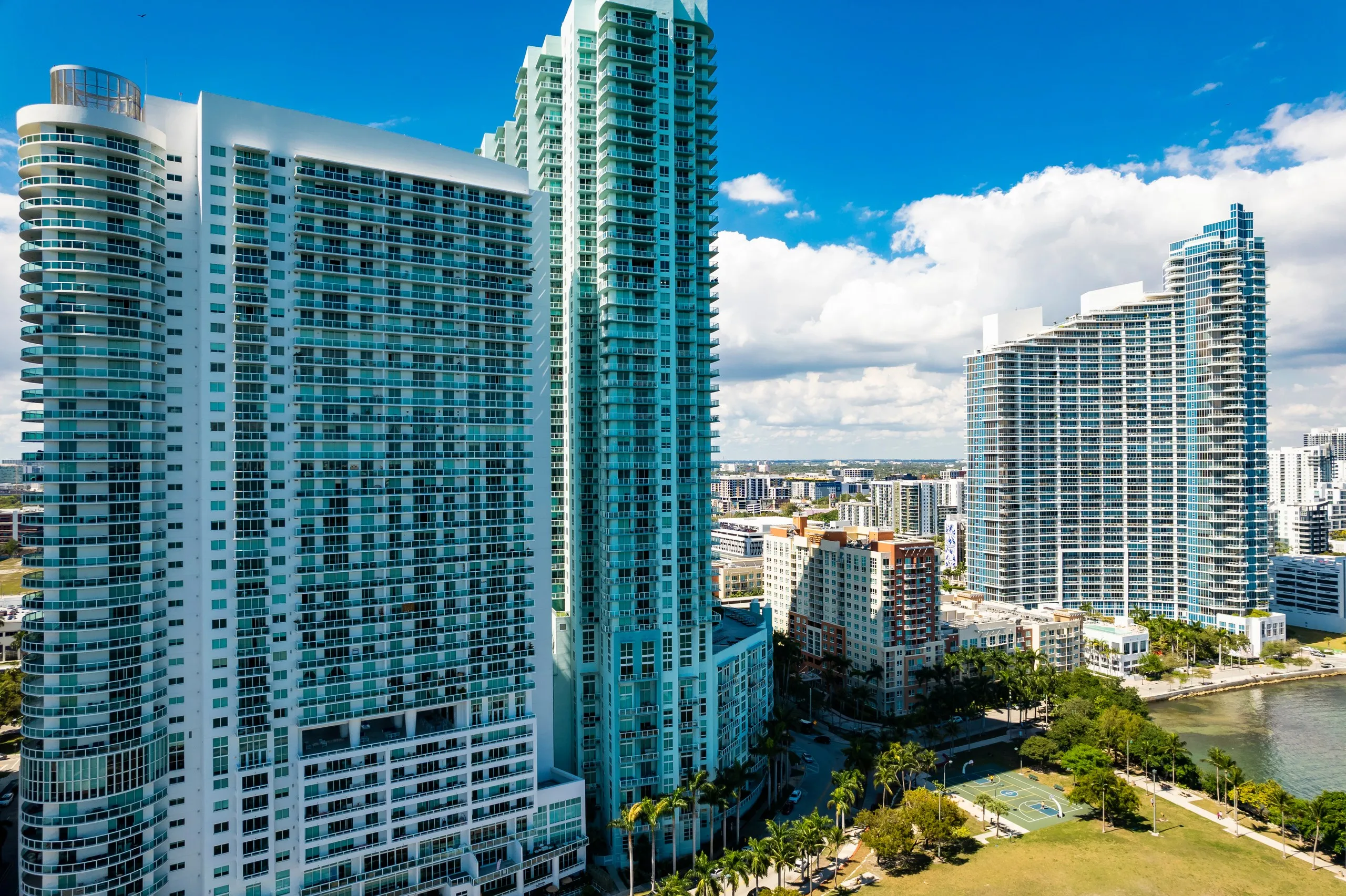 Close aerial view of high-rise residential towers in the Edgewater neighbourhood of Miami beside Biscayne Bay